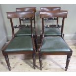 A set of four William IV mahogany dining chairs, concave cresting rails,