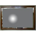 A Victorian walnut landscape mirror with reeded frame and bevelled plate,