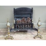 A good reproduction cast iron and brass fire back in late 17th century style,