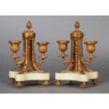 A pair of mid 19th century ormolu two branch candlesticks, the spiral cast tapered column with
