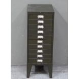 A metal filing cabinet of ten shallow drawers