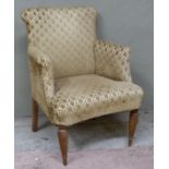 An early 20th century armchair upholstered in cut maquette on turned oak legs