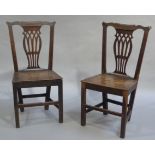 A pair of 19th century country chairs with pierced splats and fall seats on square framing