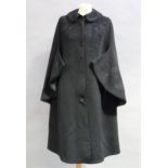 A late Victorian/Edwardian black wool cape with rounded collar applied cord detailing with beads and