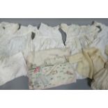 A quantity of early 20th century baby and infants' clothes including several dresses with