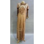 An American 19th century gown in brown and ivory circular print silk having a brown sheer pleated