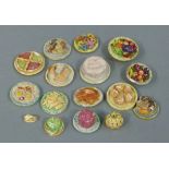 A small quantity of painted plaster dolls house food including: birthday cake, fruit bowl, jelly,