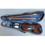 A violin, the two piece figured back with conforming ribs and table of narrow to medium grain,