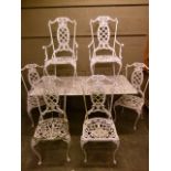 A white painted metal garden set of rectangular pierced table, two carvers and four singles