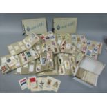 Quantity of cigarette cards including: Wills albums with Players Military Uniforms of The British