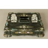 A Victorian papier mache and a mother of pearl inlaid desk standish, of rectangular bracketed