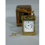 A Victorian brass carriage clock in original Moroccan case with key