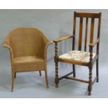 A Lloyd Loom tub chair together with an oak open arm chair with barley twist uprights