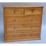 An early 20th century ash chest of two short and three long graduated drawers on plinth base,