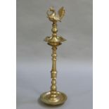 A Indian brass smokers companion with mythological bird finial