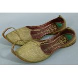 A pair of Indian slippers c.1940 lined in red leather and worked in gilt thread, together with a