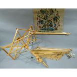 A beech cats cradle with integral clamp together with a tapestry frame and part completed needlework