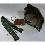 A brown velvet muff, a black silk parasol with folding handle and black astrakhan tippet