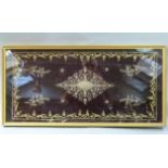 A Victorian purple velvet panel embroidered in gilt metal thread with a diamond medallion, the