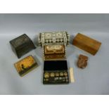 An ivory mounted domed pencil box, four other trinket or card boxes and a carved wood watch case;