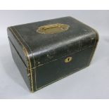 A black Morocco jewellery casket with inset brass carrying handle detailed with gilt lines,