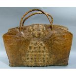A large crocodile skin grip of rectangular arched profile with twin straps and zip, 53cm wide x 48cm
