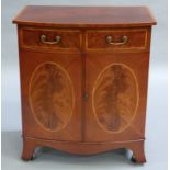 A mahogany and satinwood banded bow fronted two door tv/hi-fi cabinet, the doors modelled as fake