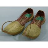 A pair of Indian slippers c.1940 lined in red leather and worked in gilt thread