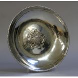 A Keswick School of Industrial Arts polished steel bowl, circular, having a notched rim and rose