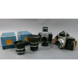 A Pentacon Six TL with aus Jena BM 1:2.8 f=80 lens No 8562958; together with a Pentacon Six Jena T