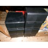 A set of four CD storage boxes each of four drawers and containing a large quantity of CDs, mainly