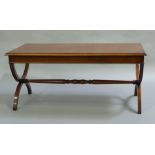 A mahogany and cross banded coffee table rectangular on 'X' refectory supports joined by a stretcher