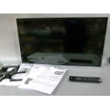 A JVC 32 inch led smart HD television with built in dvd and remote control, includes wall bracket