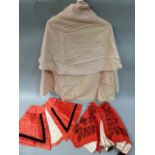 A Victorian taupe cape with applied silk braiding in floral patterns, together with a small red cape