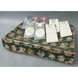 A Marshall and Snelgrove dress box together with several packs of tights including Christian Dior in