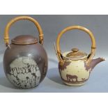 A Cookie Scottorn studio pottery teapot and cover decorated with a ploughing scene, bamboo handle,