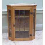 Bellman Yorkshire - carved oak and leaded glass hanging corner cupboard, carved in low relief with a