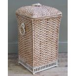 A reproduction painted metal laundry basket