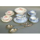 A pair of Spode willow pattern cups and saucers; together with a conforming oval teapot stand and