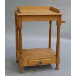 A pine washstand with three quarter gallery, turned oak legs, pine undertier fitted with faux drawer