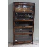 A Globe Wernicke stacking bookcase of five sections on small square legs and plinth cornice