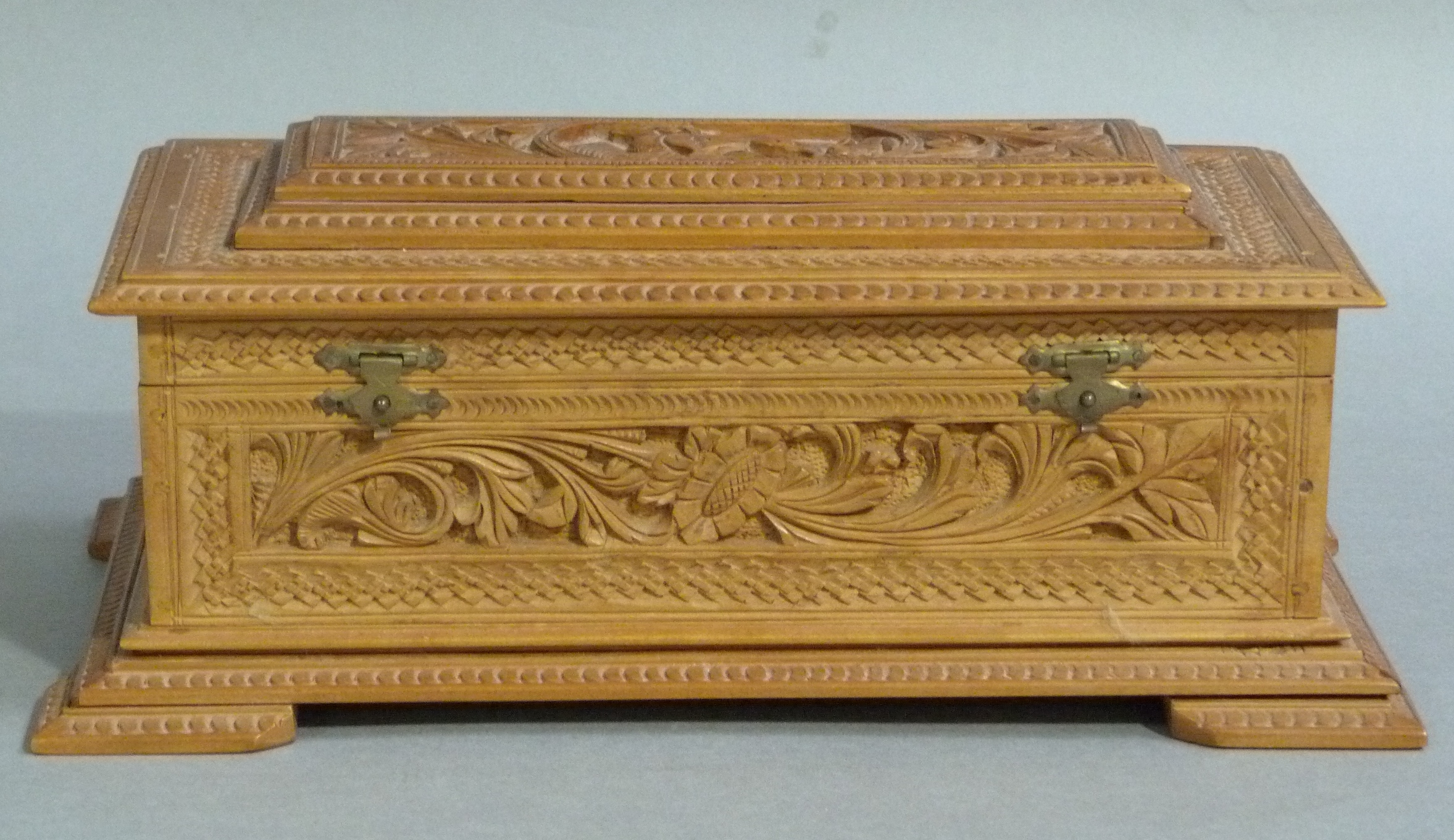 An Indian carved camphor wood casket which previously held a farewell address to Mr D R Robinson