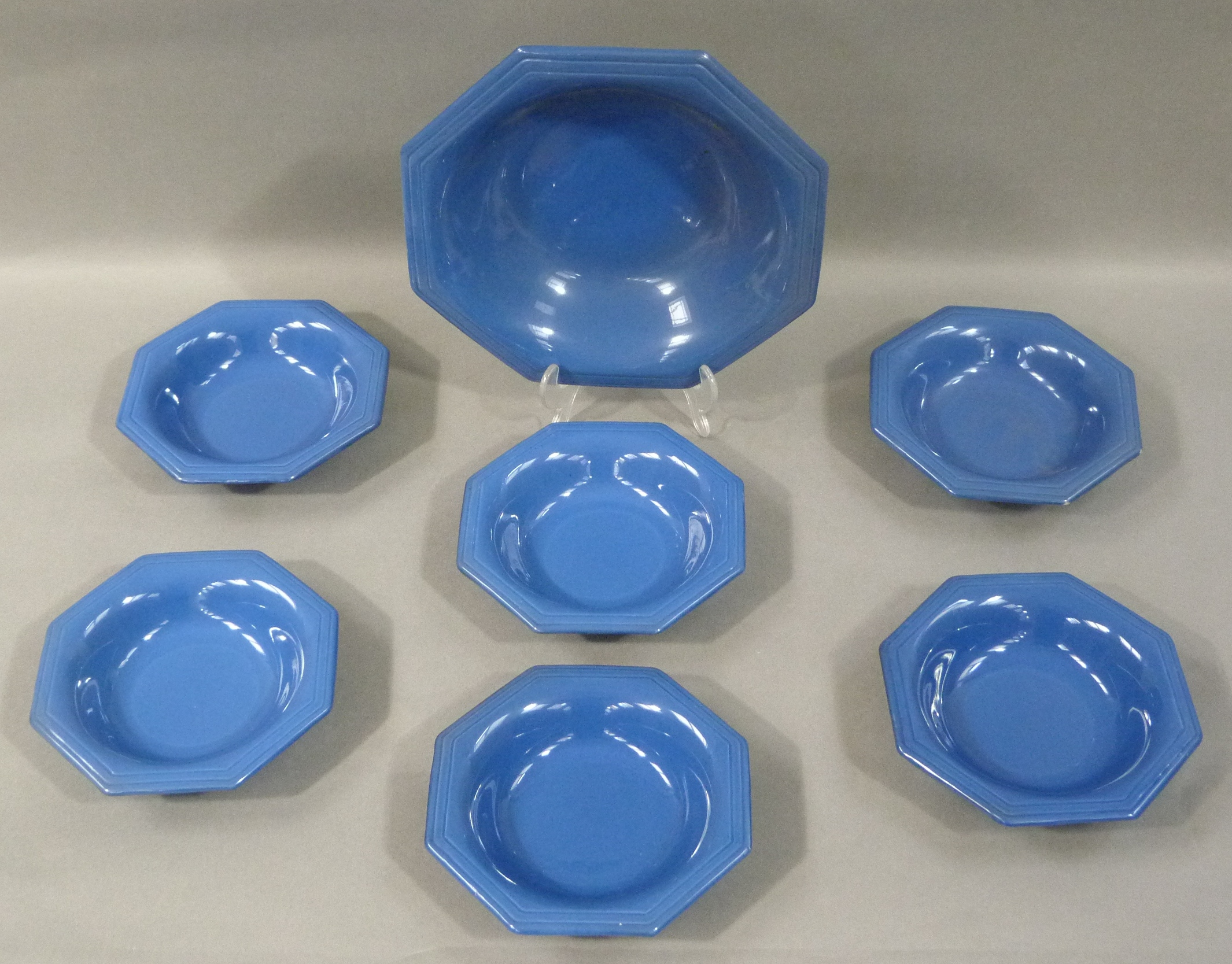 Moorcroft Powder Blue fruit set c.1920, of hexagonal outline, comprising a serving bowl and six