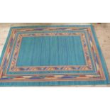 A modern rug in turquoise, rest and blue, 160cm x 230cm