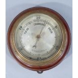 A mahogany mounted brass cased aneroid barometer, overall diameter 17.5cm