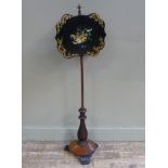 A Georgian pole screen on rosewood turned base with papier maché tray painted with flowers and