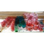Fourteen emerald and turquoise glass wines, thirteen various cranberry glass wines and two cranberry