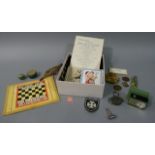 A miscellany including Dr La Rue & Co Improved Pocket Chess Board with chess men, miniature tins,