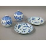 Two Chinese blue and white plates, one decorated with crayfish the other with crabs, within formal