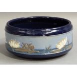 A Lovatt's Langley ware circular bowl, relief decorated to the body with a band of lily pads and